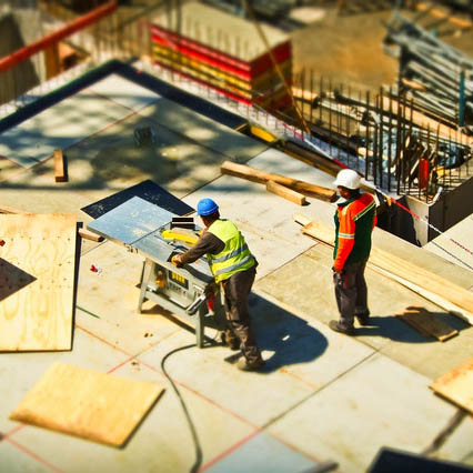 two constructional professional working on roof