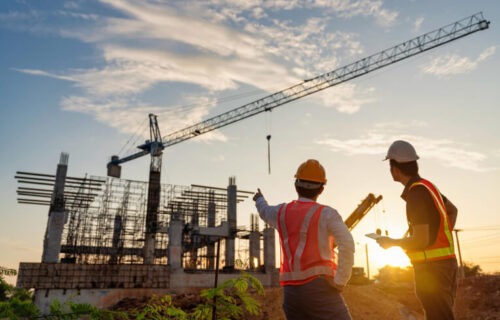 An aesthetic picture of two construction buddies looking at the site they have just created