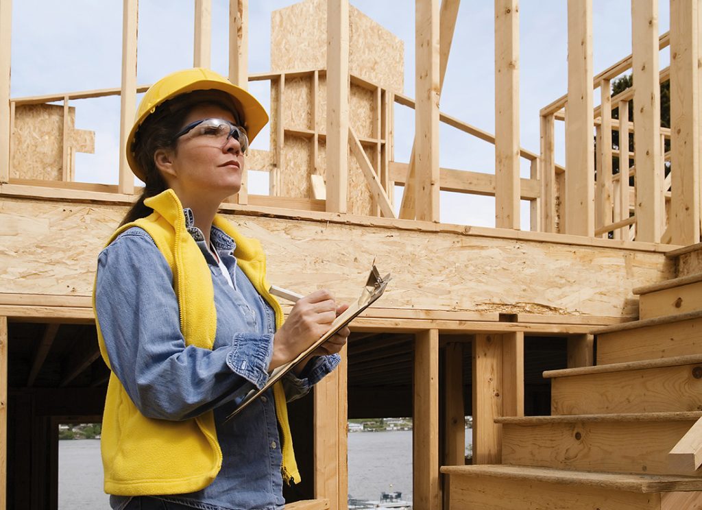 A construction woman taking notes
